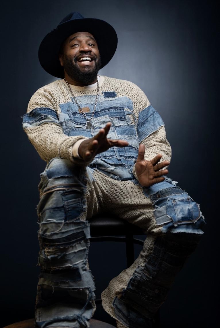 COREY HOLCOMB, comedian